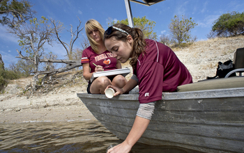 Scientists collect samples from the Chobe River for water quality assessments.